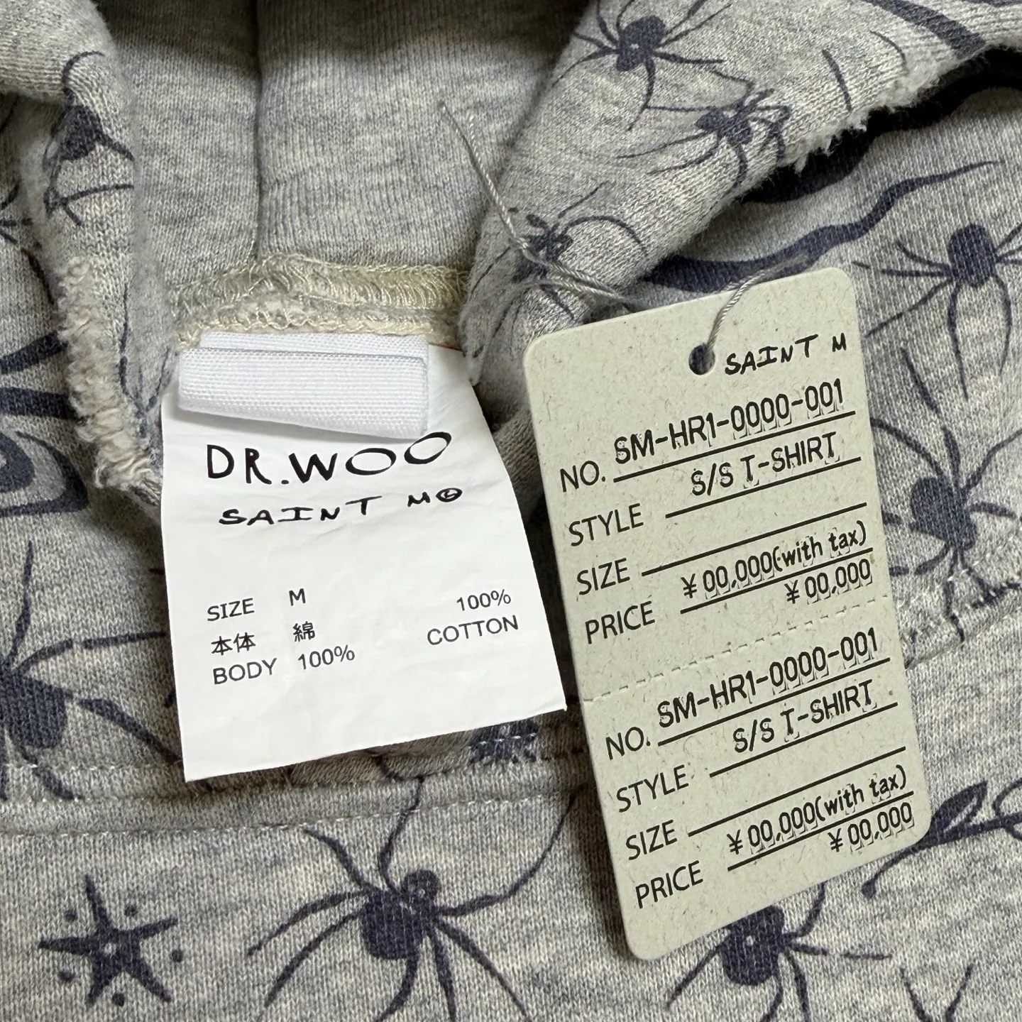 More accessories details SAINT Mxxxxxx x DR. WOO HOODIE ' Dr.Woo ' /GRY Flame Swirl Spider Web Hoodie Distressed Gray S-XL Custom-woven and dyed nostalgic gray fabric. After printing, the garment is sprayed with potion to make the fabric oxidize and fade, plus a large number of artificial fabric destruction processes, making the whole piece of clothing look old and unique as a work of art. This hoodie is co-branded with a famous tattoo design artist. A full set of Dr.Woo accessories has been customized. Bringing you authentic items!